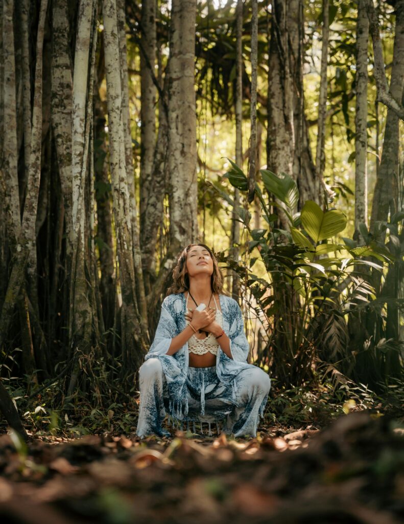 Woman meditating in a lush Peruvian forest, embodying calm and mindfulness.